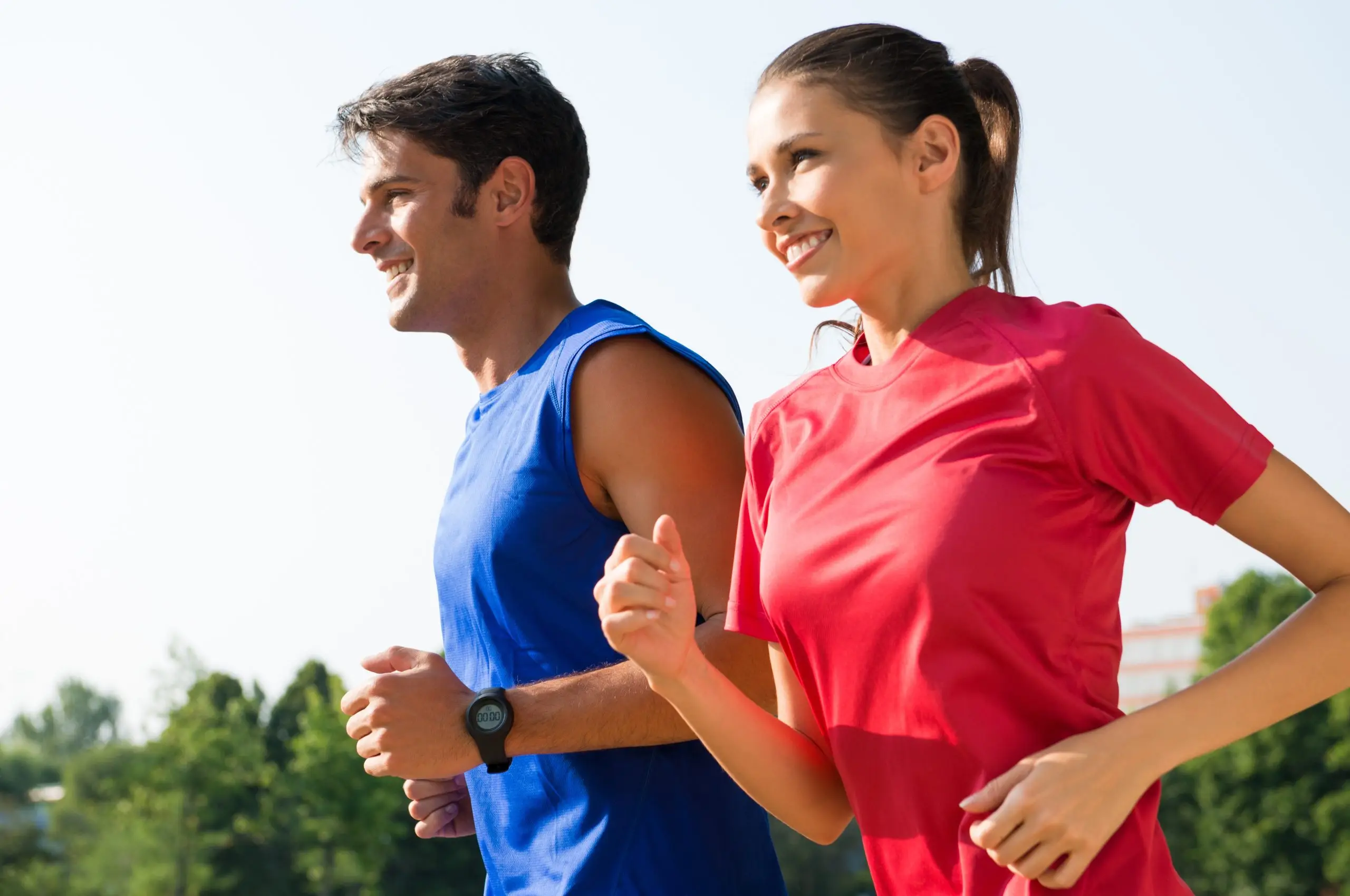Happy Couple Jogging Outdoor Young Healthy Couple Jogging At Park In Early Morning
